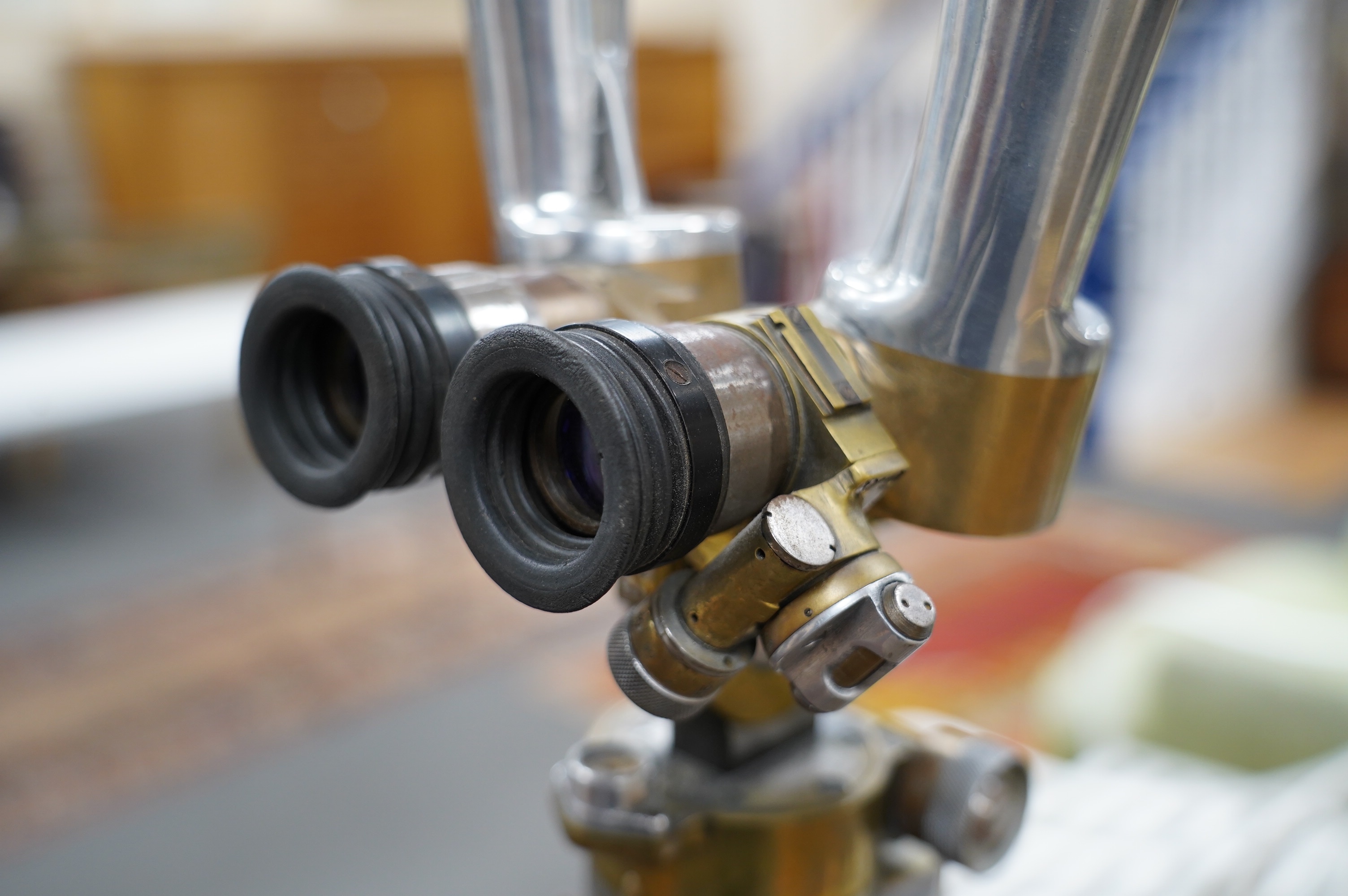 A pair of Czech army polished alloy and brass ‘donkey ears’ trench binoculars, stamped ‘ASZT. 10x45 522660 41 1956’, together with the correct oak tripod stand. Condition - fair to good